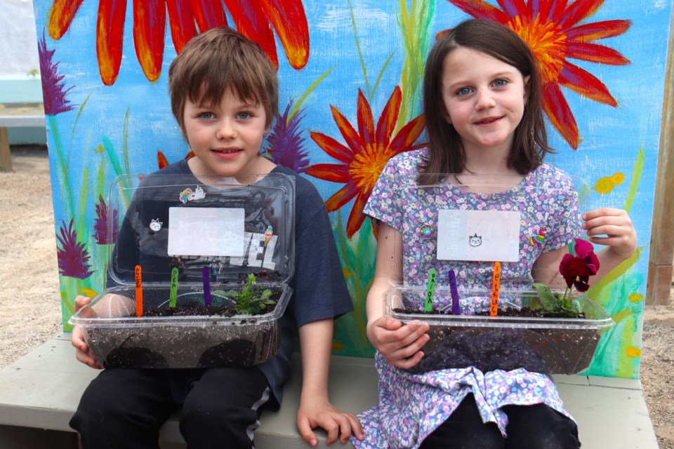 Kids learned how to grow their own veggies and maintain a mini edible garden during hands-on workshops at New North Greenhouses' seasonal grand opening on April 20, 2024.