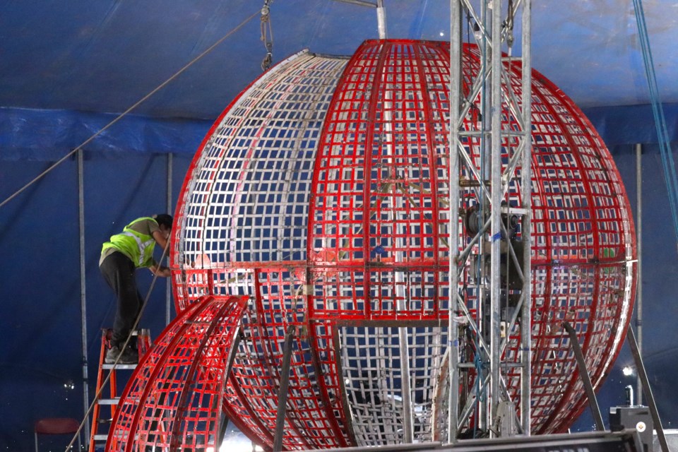 Out-of-town crews are busy at work outside the Station Mall in preparation for this weekend's Great Benjamins Circus. 