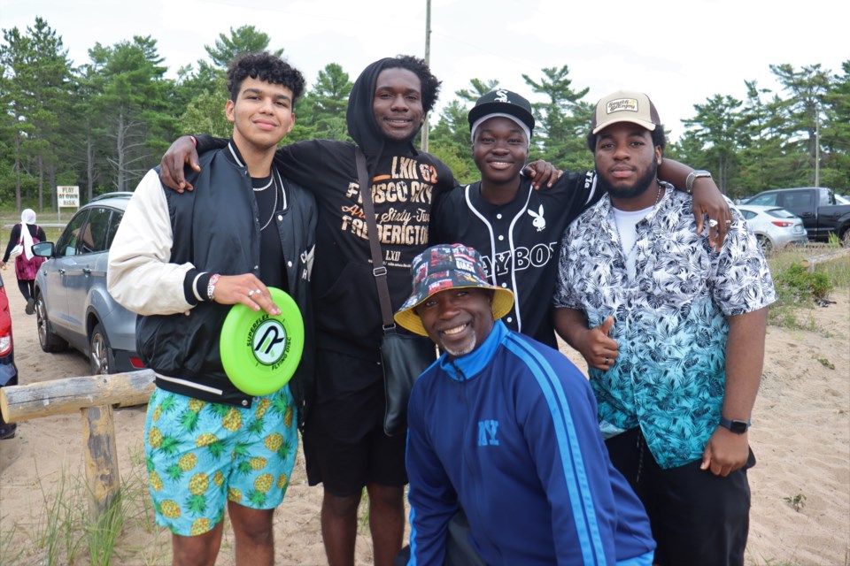 ACCANO president Dave Mornix (front) is pictured with several post-secondary students who are new to the Sault during a social event at Ojibway Park in Garden River on Aug. 12, 2023