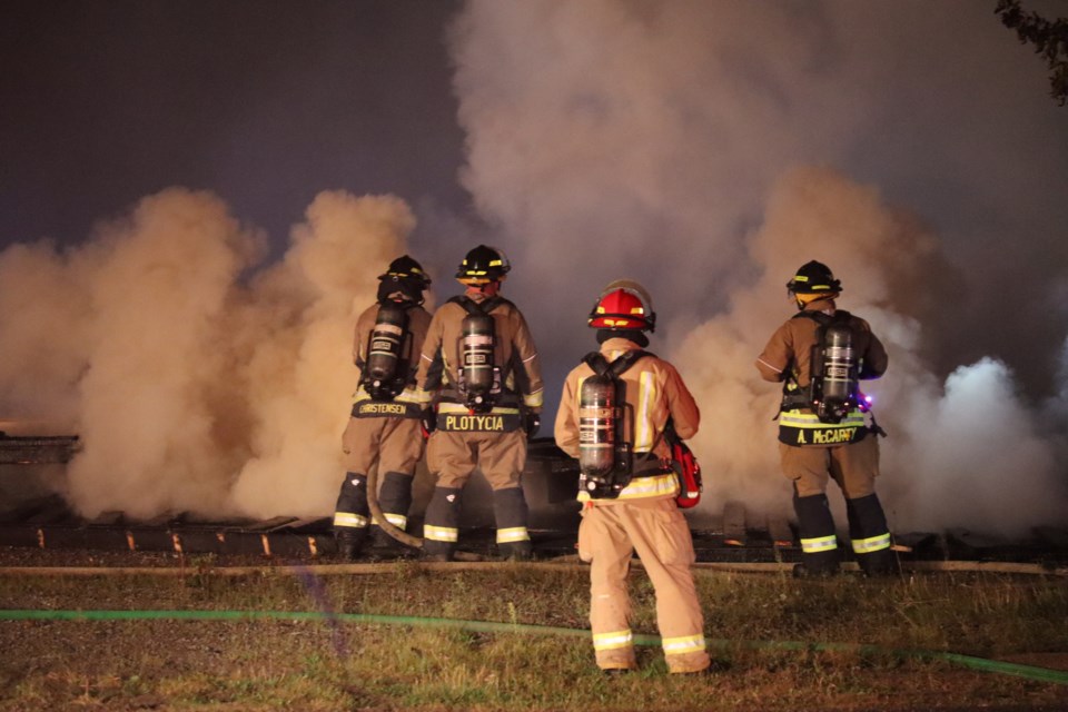 Fire crews battled thick smoke and tall flames as a portion of the former St. Veronica Catholic school burned to the ground into the early hours of Sunday morning.
