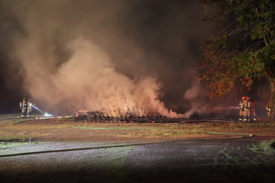 Fire crews douse the flames of a late-night fire at the former St. Veronica's elementary school on Friday Sept. 16.