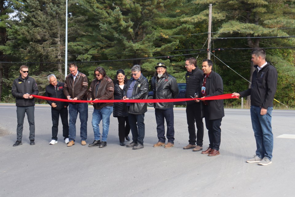 Highway 17B resurfacing partners and workers cut a ribbon to celebrate the completion of the $16.9 million project at the Garden River Band Office on Wednesday.