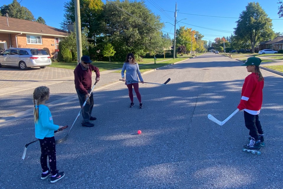 Just two months shy of turning 100, former NHLer Steve Wochy enjoys playing street hockey with the Vilaca family on Retta Street. 
