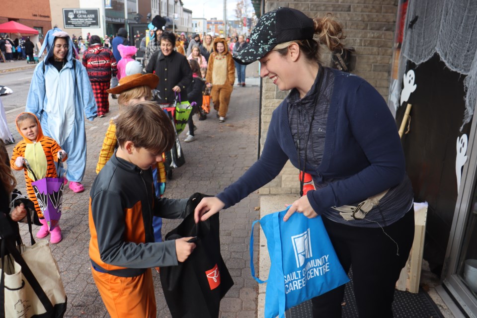 Cooler temperatures didn't keep away the hundreds of local families who dressed up and trick-or-treated along the downtown core during the popular Halloween on Queen event on Oct. 28, 2023.