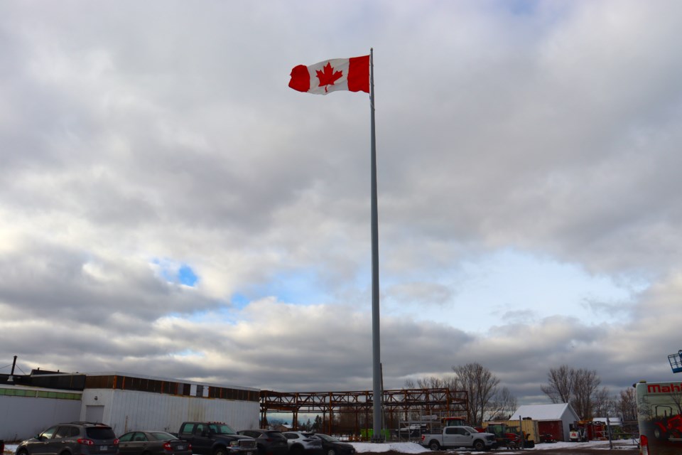 The team at Service Rentals and Sales on Sackville Road believe they have constructed Algoma's tallest Canadian flagpole at a height of 120 feet.