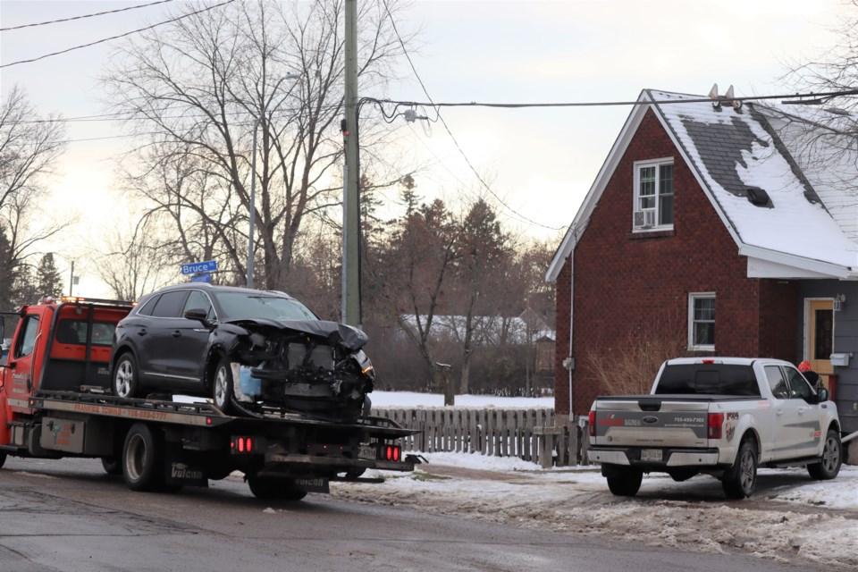 A vehicle with damages to its front end was taken away from the scene of a collision at the corner of Bruce Street and Gladstone Avenue shortly after 2:30 p.m. on Nov. 23, 2022.