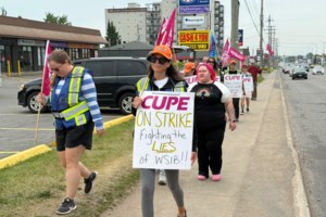 'We all need to come together': Local workers rally as strikes drag on