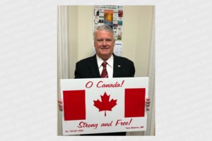 Sheehan offering flag lawn signs for Canada Day