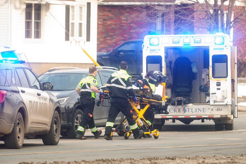 A woman is placed into an ambulance by Sault Ste. Marie Paramedic Services after an apparent collision on Queen Street East at Churchill Boulevard on Saturday afternoon. 