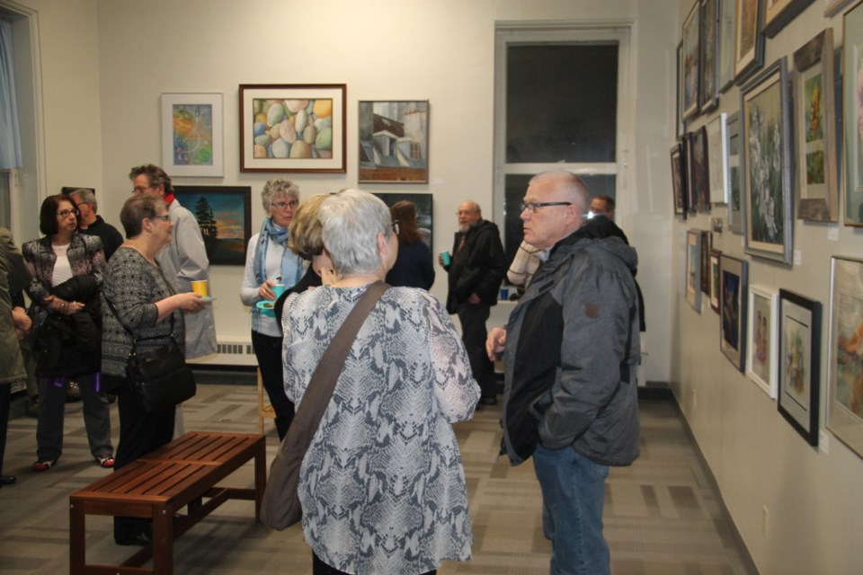 Artists, members of the public, mingle at the opening of the Algoma Art Society’s 70th anniversary exhibit at the Sault Ste. Marie Museum, March 1, 2018. Darren Taylor/SooToday
