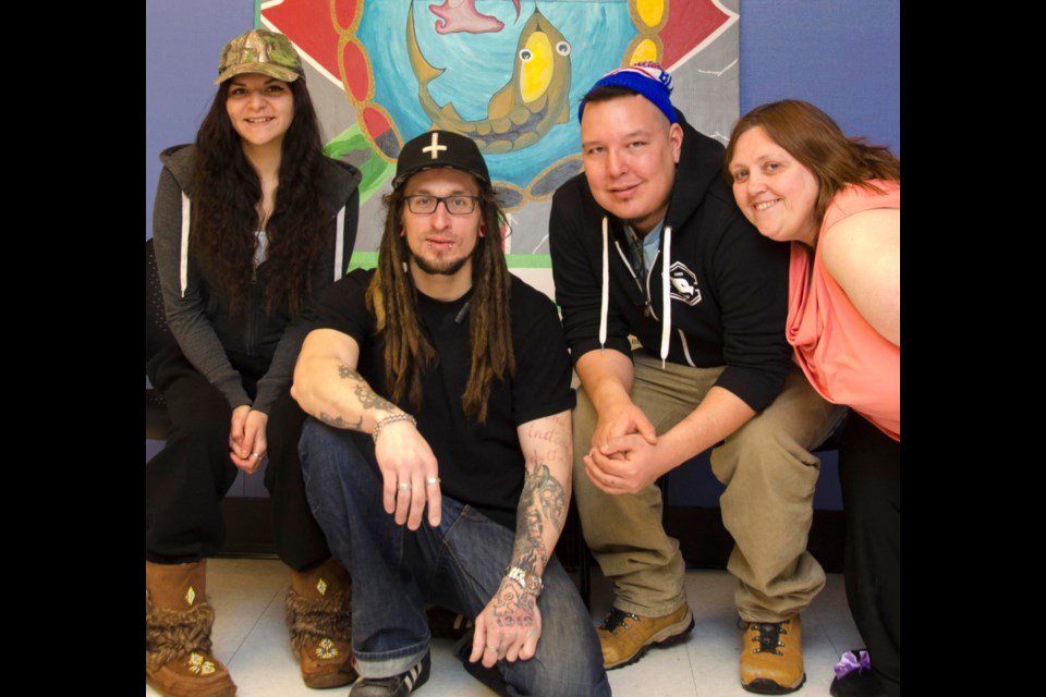 Kady Manitouwabi, Jayke Carter, Dominic Migwins and Carol Wilhelm-Harvey, part of a group of Urban Aboriginal School artists who painted a Canada 150-themed mural which will be displayed across Canada.  Photo by Tammy Fiegehen. 