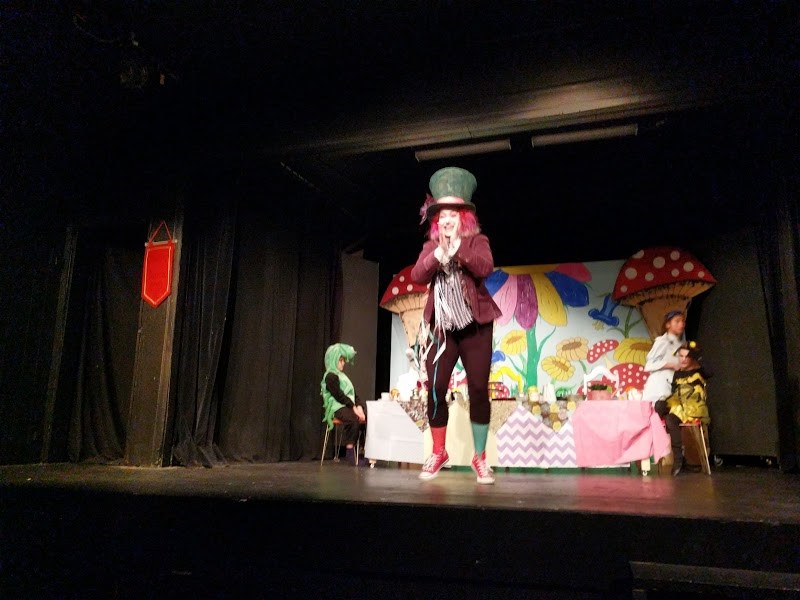 The Hatter played by Elora Nelson about to play a game with the audience