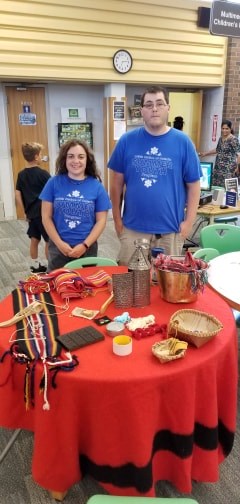 Josh and Shalee, Summer Program Facilitators with Métis Nation of Ontario at the Library teaching finger weaving, dot drawing, and interesting facts about Métis culture Wednesday 