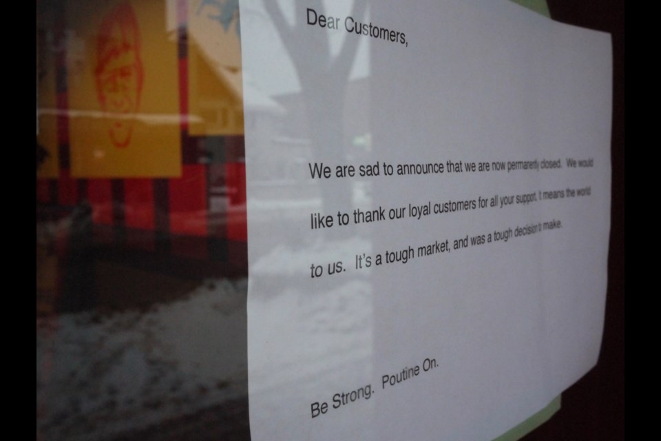 A sign on the entrance to Smoke's Poutinerie tells customers the restaurant has closed for good. Michael Purvis/SooToday