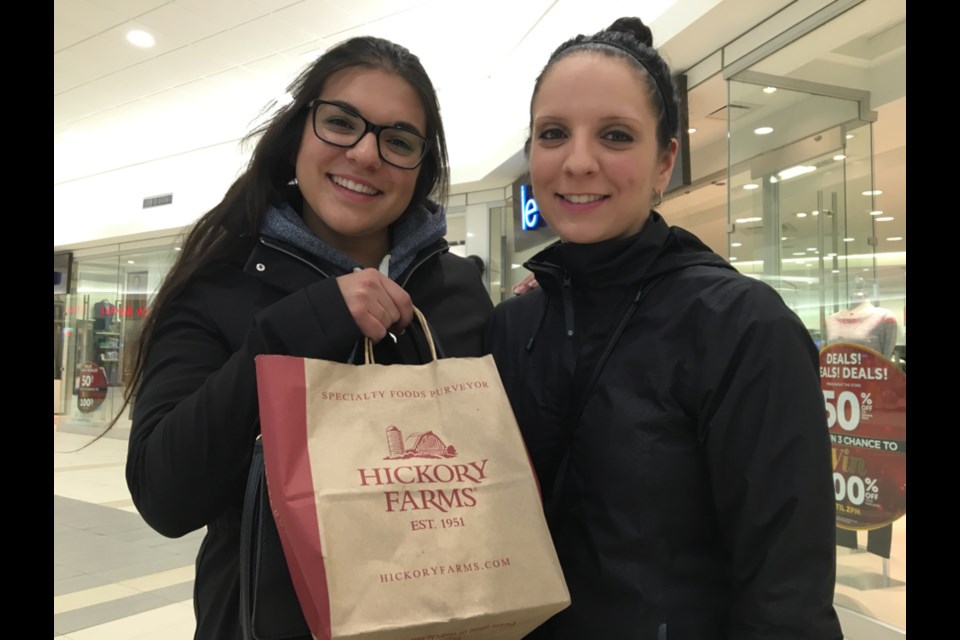 Despite some bargains to be had in Sault, Mich. and online, sisters Amanda and Sarah Dubois took advantage of Black Friday deals in Sault, Ont., Nov. 24, 2017. Darren Taylor/SooToday  