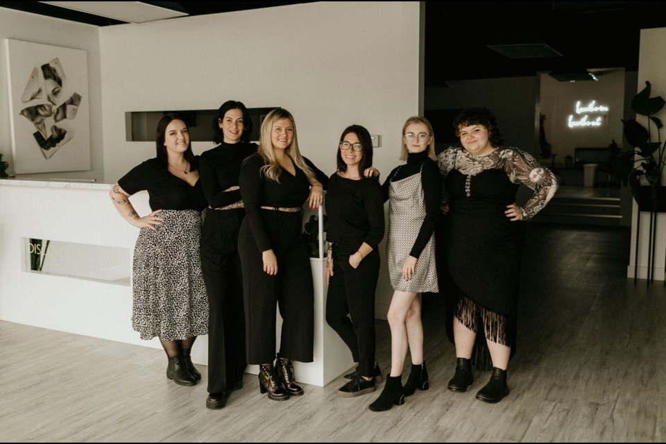 Katrina Thibodeau, artist/tattoo artist and Discover The Canvas owner (third from left), with photographer/videographer/studio manager Riley Wilson, tattoo artist Katlyn Foisy, piercer Angela Duncan and new apprentice tattoo artists Madison Delfgou and Senga-Jean Cormier. Photo by Brie Gallagher 