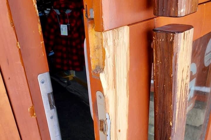Thieves damaged this door on their way into Joe's Sport and Surplus early Wednesday. Facebook photo