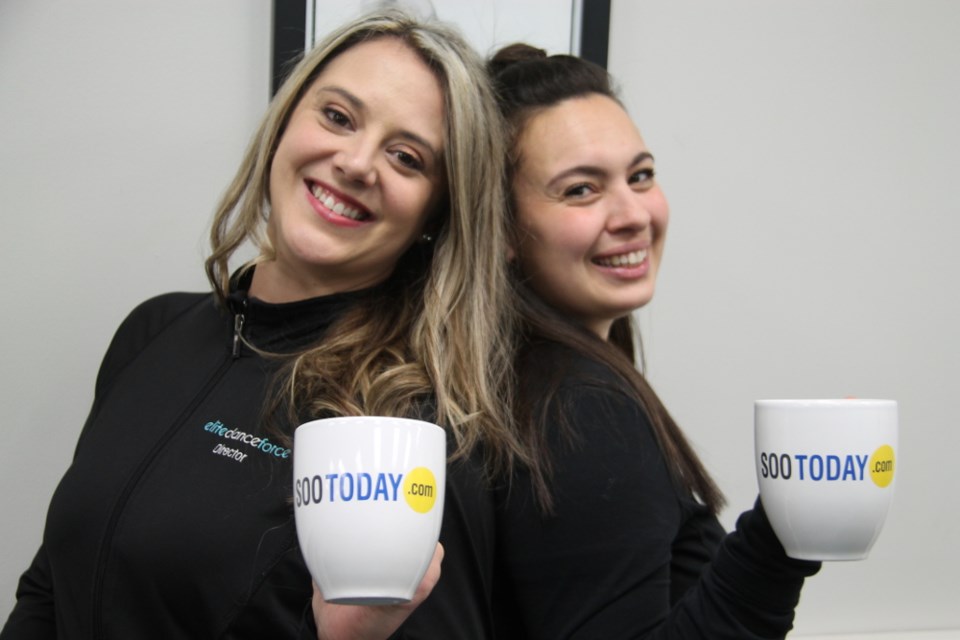 Kaitlin Pelletier and Christina Trevisan, owners/directors of Elite Dance Force, with their complimentary SooToday coffee mugs, Jan. 17, 2018. Darren Taylor/SooToday 