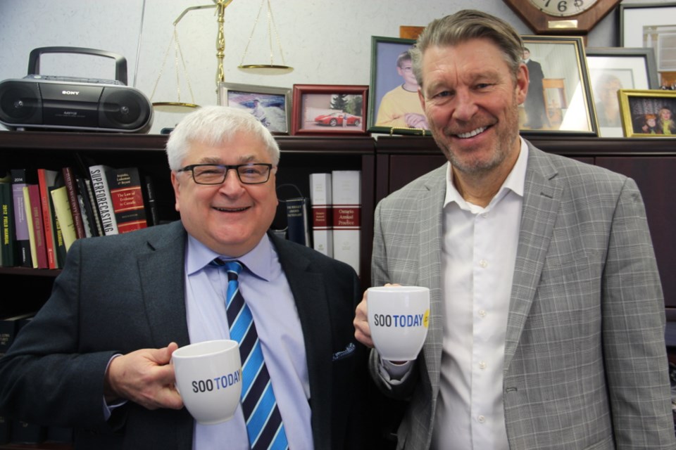 Orlando Rosa and Gord Acton, Wishart Law Firm’s senior partners, with their complimentary SooToday Mid-Week Mugging coffee mugs, Jan. 31, 2018. Darren Taylor/SooToday