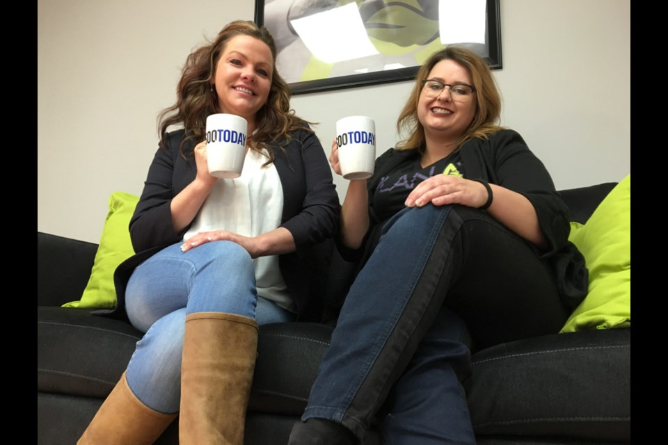 Sheri-Ann Morin, Plan A Algoma owner/operator, and Amanda McBain, recruitment and marketing manager, with their complimentary SooToday coffee mugs, Feb. 14, 2018. Darren Taylor/SooToday