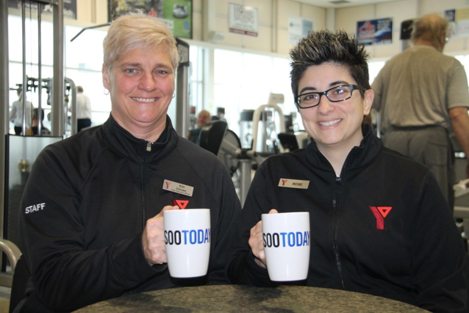 Kim Caruso, Sault YMCA CEO, and Rose Berardelli, Sault YMCA marketing and membership services manager, with their complimentary SooToday coffee mugs, Feb. 21, 2018. Darren Taylor/SooToday