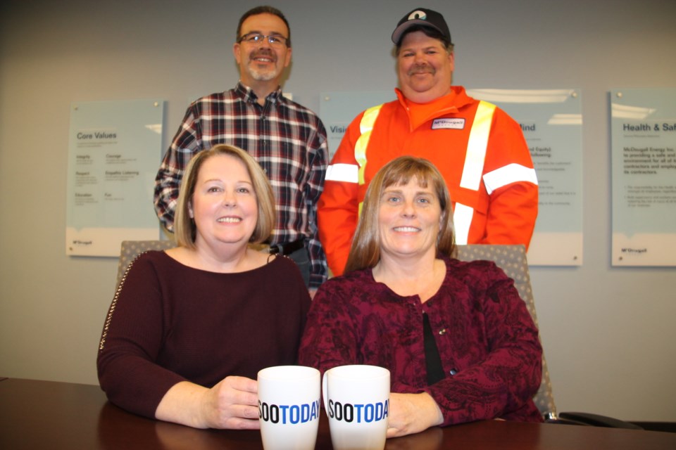 McDougall Energy team members Karen Smith, fuel reconciliation clerk, Jennifer McDougall, human resources director (seated, left to right with their SooToday coffee mugs), Richard Royal, corporate driver training and development manager and Tom Ferragini, fuel/lubricant driver (standing, left to right), March 28, 2018. Darren Taylor/SooToday  