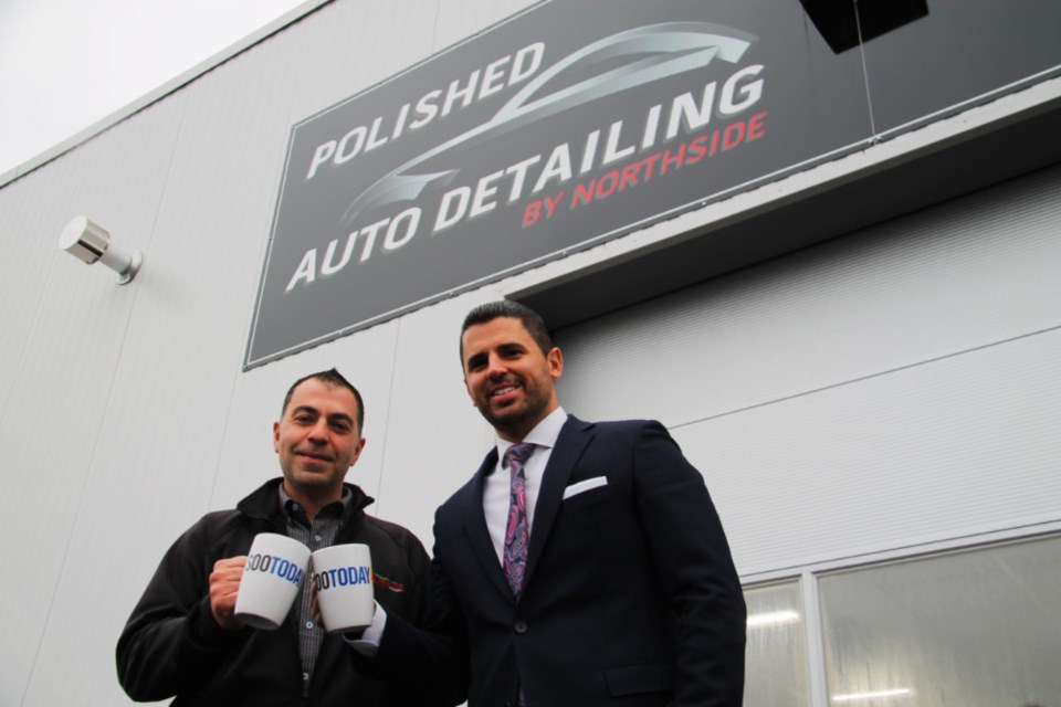 Peter Palumbo, Northside Toyota service manager, and Mario Palumbo, Northside Toyota dealer principal, with their complimentary SooToday mugs outside the recently-opened Polished Auto Detailing by Northside, Oct. 26, 2018. Darren Taylor/SooToday 
