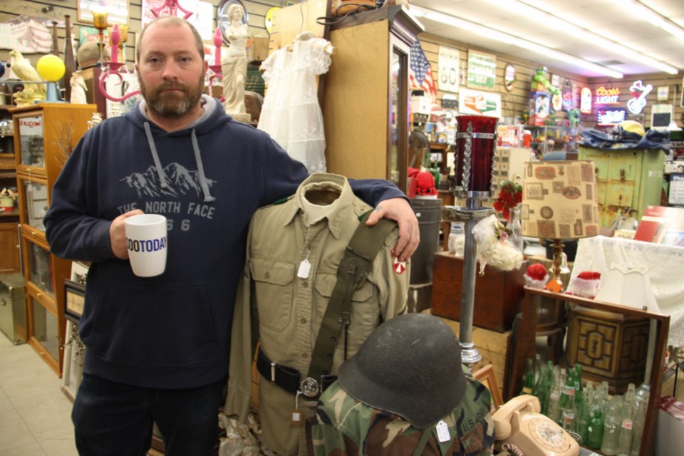 Vintage Games ‘N Junque owner/operator Michael Turcotte, pictured with his complimentary SooToday coffee mug, among his treasure trove of antiques and collectibles at 165 Queen St. E., Nov. 24, 2018. Darren Taylor/SooToday