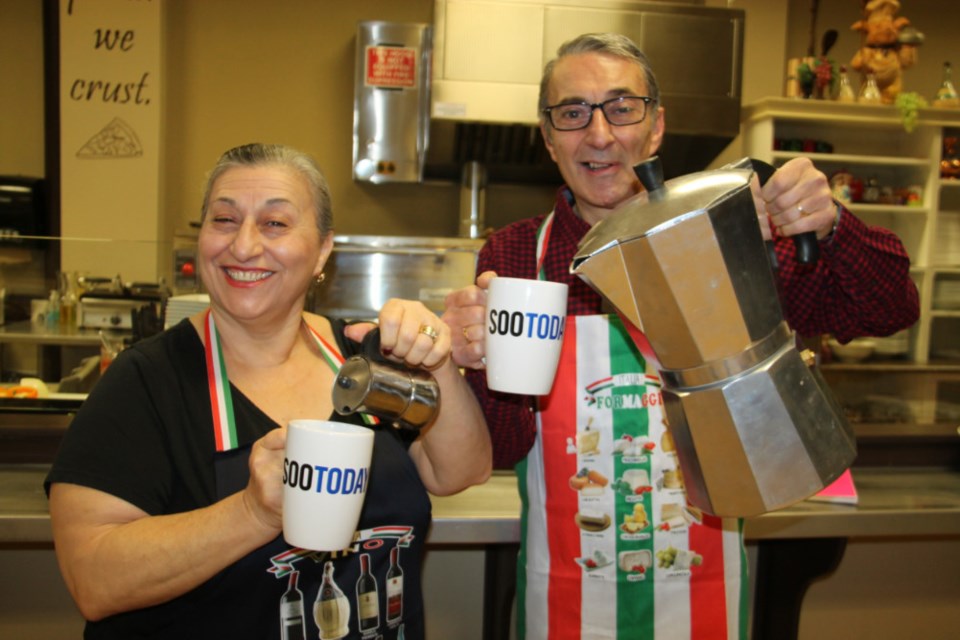 Rosetta Sicoli and brother Mauro Sicoli of Nonna’s Cucina getting ready to fill up their complimentary SooToday coffee mugs, Dec. 10, 2018. Darren Taylor/SooToday