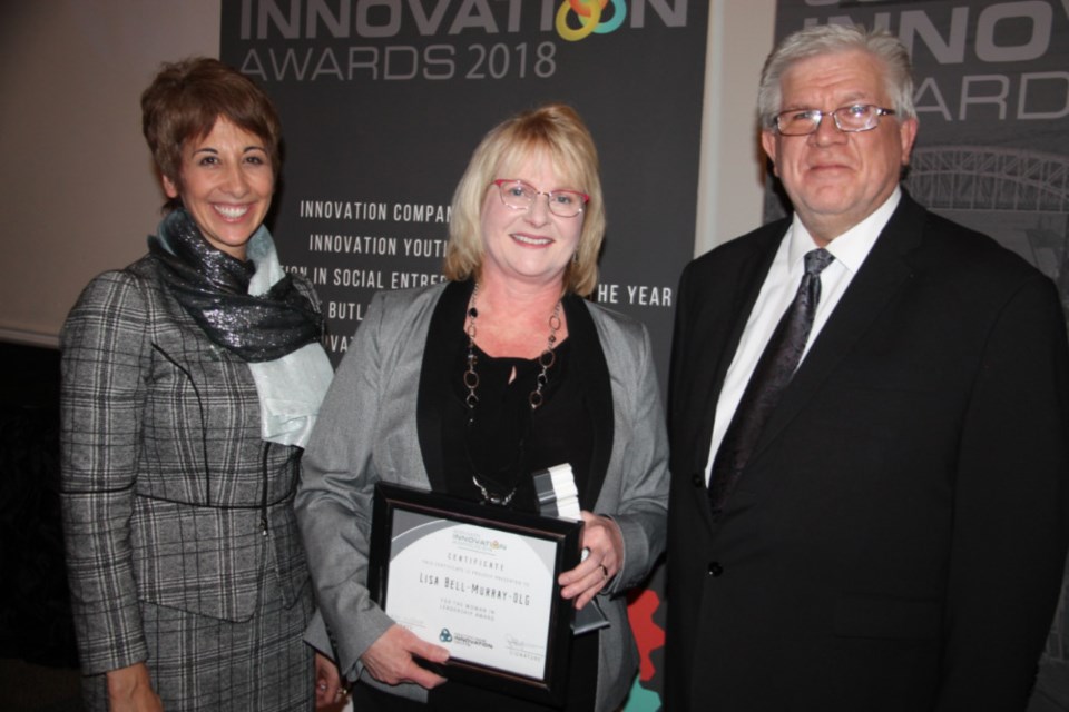 Asima Vezina, Algoma University president and vice-chancellor, Lisa Bell-Murray, OLG chief financial officer and SSMIC SSMARt Innovation Award winner (Woman in Leadership Award) and Peter Bruijns, SSMIC executive director, Nov. 21, 2018. Darren Taylor/SooToday