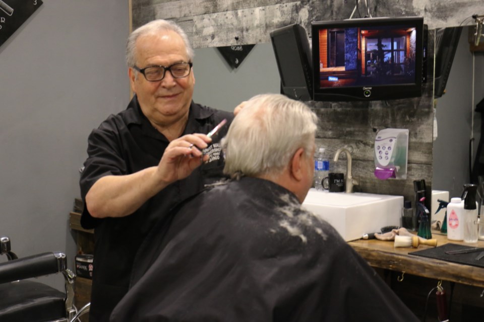 Market Mall Barber Shop owner Gino Polito has been cutting hair for 55 years. He began his career in Sault Ste. Marie 50 years ago after moving here from Italy. James Hopkin/SooToday 
