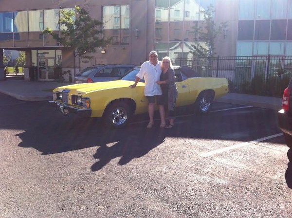 Jeff Ansley and wife Brenda with his parents' 1973 Mercury Cougar convertible.  Photo supplied by Jeff Ansley.