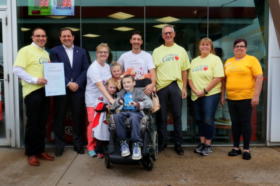 Representatives from McDougall Energy Inc., Children' Wish Foundation of Canada and the Rotary Club of Sault Ste. Marie were joined by Mayor Christian Provenzano and the family of Billy 'Dozer' Adam for Wednesday's cheque presentation at the Trunk Road Esso as part of National C-store Day. James Hopkin/SooToday