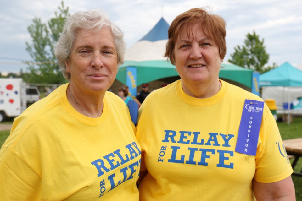 Sisters Nancy Turbin, left, and Donna Rickard - both survivors of cancer - wanted to walk the survivors lap at Relay For Life to honour family members who have been impacted by cancer. James Hopkin/SooToday