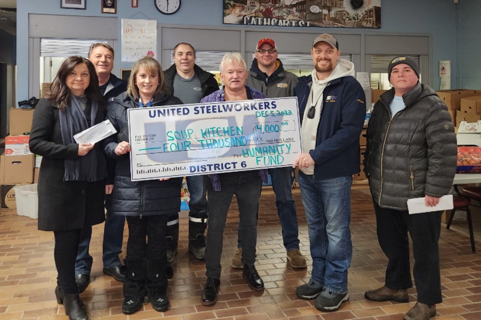 Left to right: Front Row – Jill Hewgill, Local 8748 vice president; Lisa McCaig, Local 8748 president; Ron Sim, Soup Kitchen general manager; Cody Alexander, USW staff representative; Rebecca McCracken, Local 2724 president. Back Row – Joe Krmpotich, Local 2251 Union coordinator; Hans De Feyter, Local 9548 president; and Adam Guizzetti, Local 2251 union coordinator.