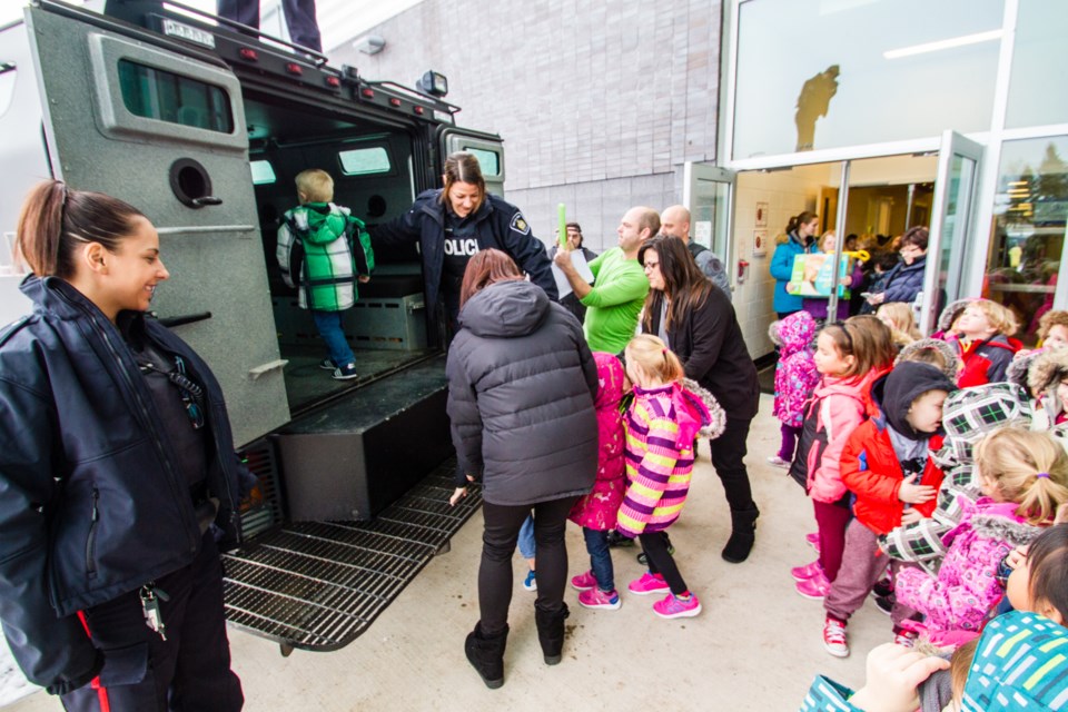 The staff and students of F.H. Clergue School enlisted the help of the Sault Ste. Marie Police Service to transport donations to the Christmas Cheer depot on Friday, Dec. 9, 2016.  Donna Hopper/SooToday