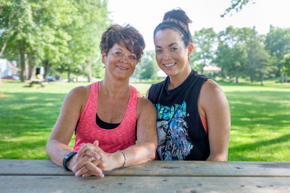 The pop-up fitness boot camp 'Sweat for a Cause' raised money for the John Howard Society this week. The event was also a tribute from Jenna Stortini (right) to her mother and organization executive director Suzanne Lajambe (left). Jeff Klassen/SooToday