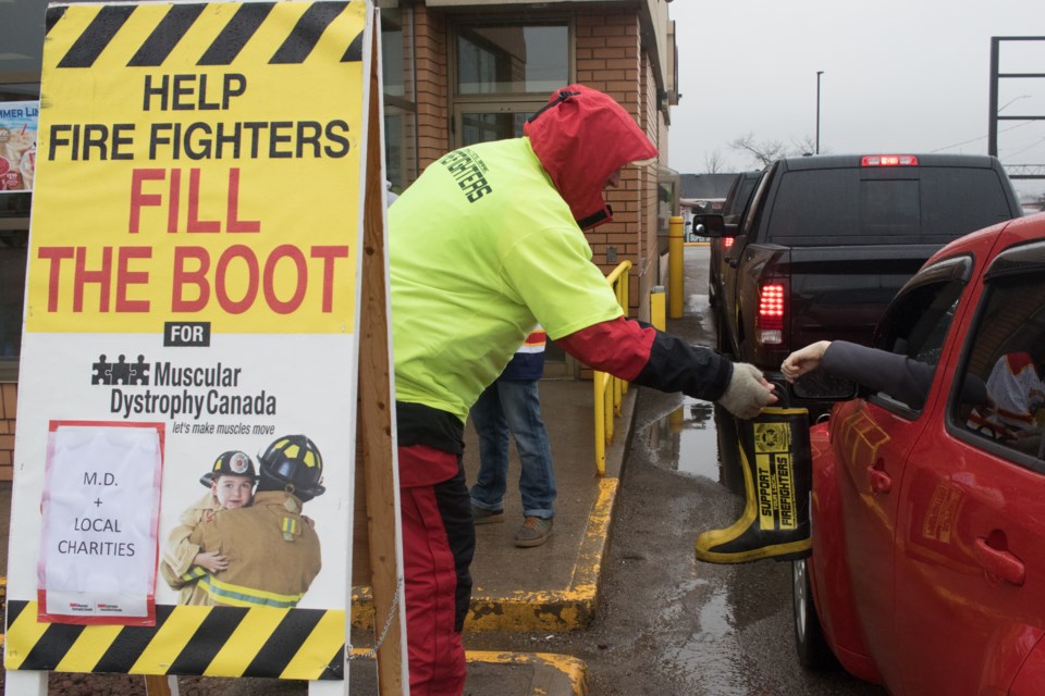 Local firefighters (Marty Kenopic pictured) were at the Tim Hortons on Great Northern Road and Second Line East collecting donations at the drive thru. Jeff Klassen/SooToday
