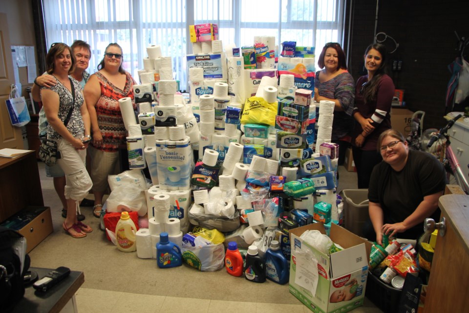 Social Work students donated a mountain of toilet paper and other essential items to the Soup Kitchen Community Centre, July 25, 2016. Darren Taylor/SooToday