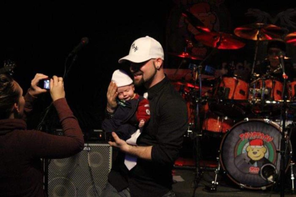 Newborn Gavin Gaetano with musician father Mike Gaetano at musical charity event Toystock a decade ago.