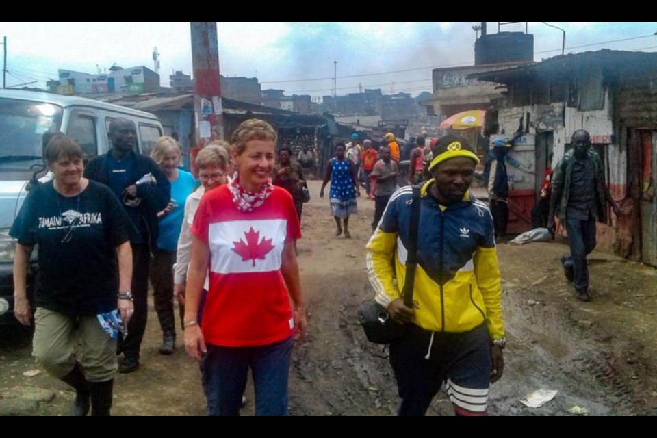 Jeannine Jefferson and members of Tumaini Afrika walk through the Mathare Slums in Nairobi. Photo supplied