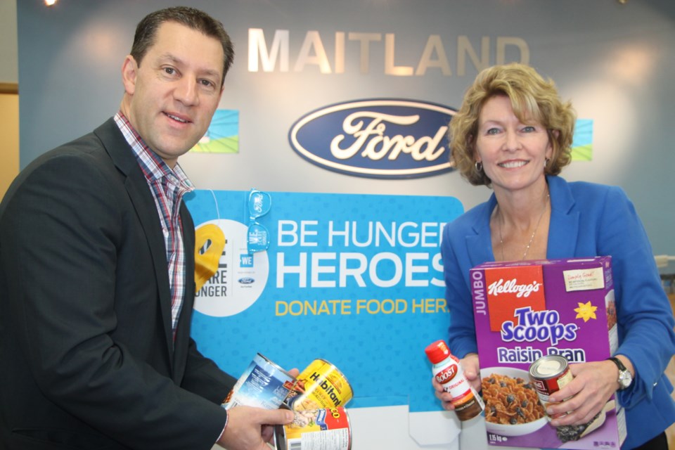 Sault MPP David Orazietti and Maitland Ford Lincoln's Judith Kovala are doing their part to fight local hunger by donating to the WE Scare Hunger program, October 24, 2016. Darren Taylor/SooToday 