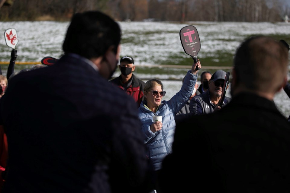 Pickleball players cheer during the ribbon cutting for eight new pickleball courts at the Elliot Sports Complex on Thursday.