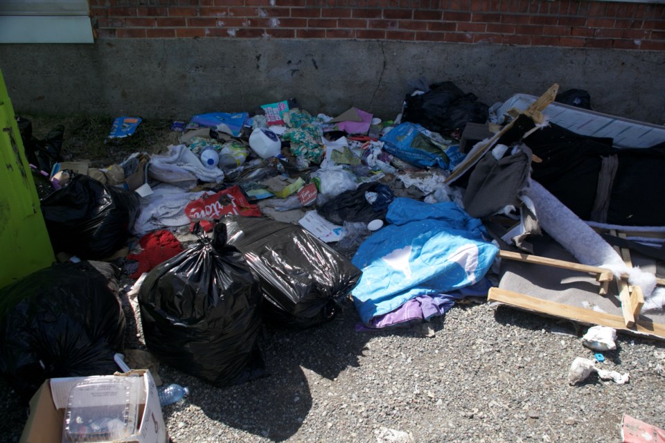 Garbage seen Thursday at the rear of 62-68 Wellington St. W. Neighbours told SooToday that complaints were made to the city but by Thursday nothing had been done. By Tuesday the garbage bags and trash had been cleared from the site.