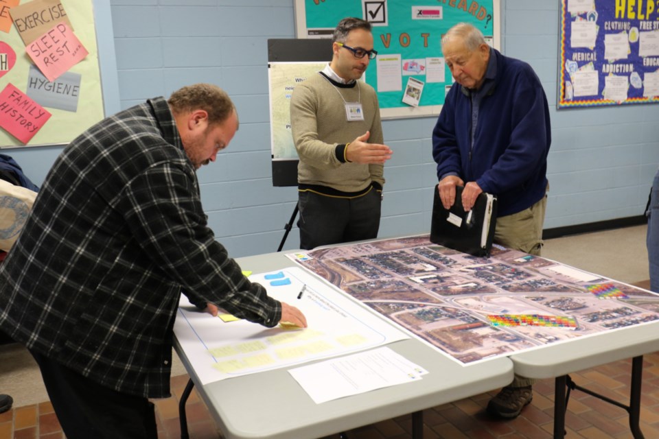 City of Sault Ste. Marie Senior Planner Steve Turco, middle, speaks with people during a public imput session on the Jamestown neighbourhood Wednesday. James Hopkin/SooToday 