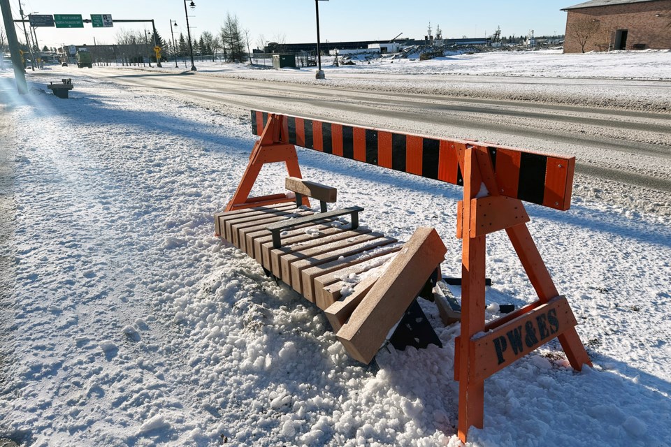 A bench on Bay Street is covered until it can be repaired or replaced by public works.