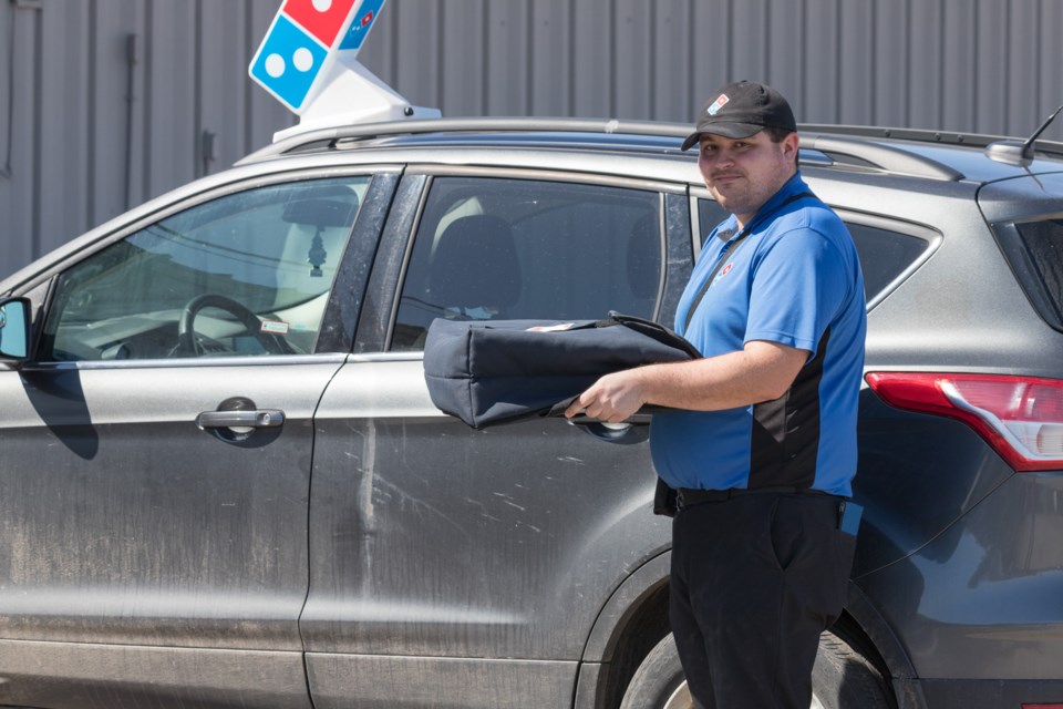 Ryan delivers for Domino's Pizza.  Violet Aubertin for SooToday