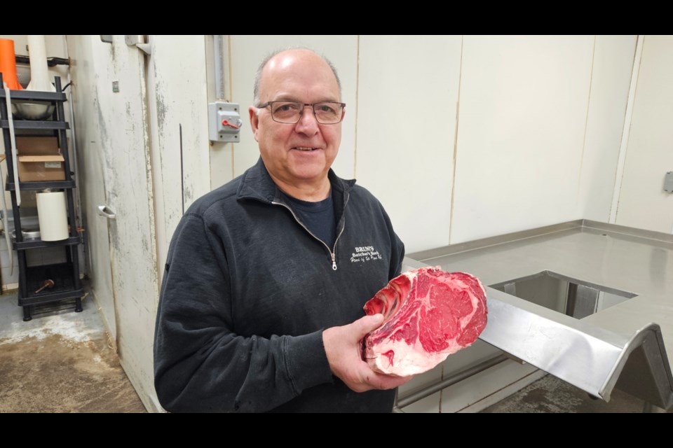 Lou Bruni, Bruni’s Fine Foods owner/operator with prime rib, March 24, 2025.