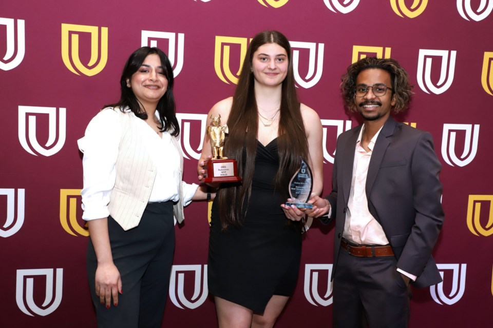 The Sault’s Chelsea Kennedy with Cambrian College badminton coaches Shruti Garg and Jofray Anto.