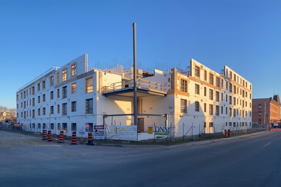 Developer One Ten Pim Inc. persuaded the city's committee of adjustment this month to add five more residential units to the project, while eliminating  22 of the 135 required parking spaces